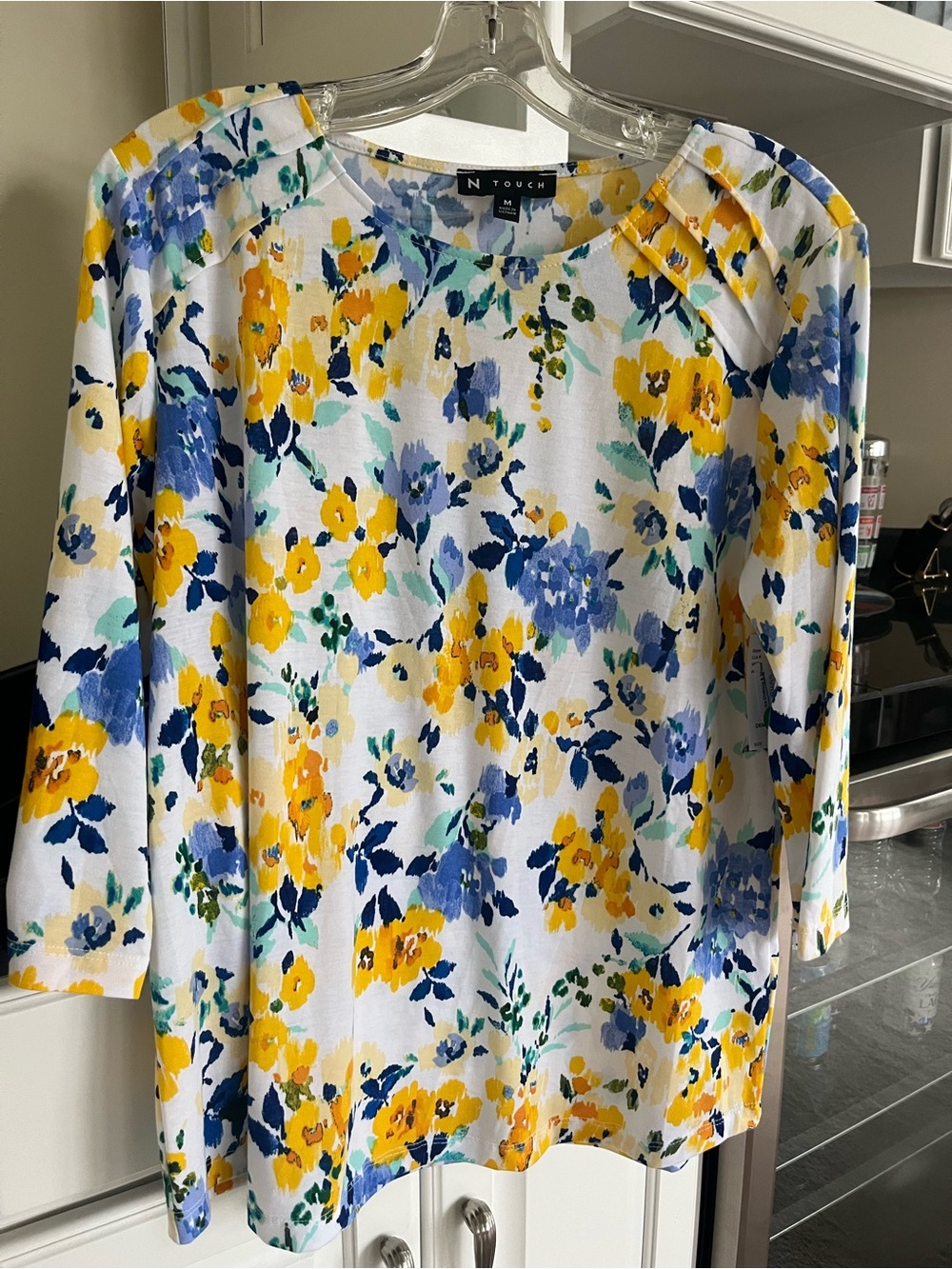 White Floral Knit TunicTop with Yellow & Blue Bloom Print. Brand new size Medium